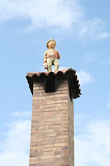 Image showing Man standing on  chimney