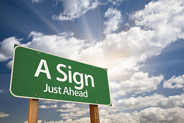 Image showing A Sign Green Road Sign Against Clouds