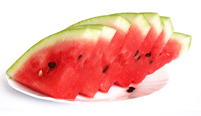 Image showing Slices of juicy watermelon served on white plate isolated on whi