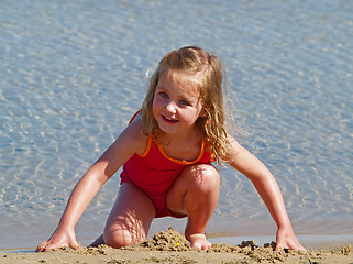 Image showing girl playing in sand