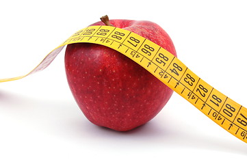 Image showing Apple and measuring tape on white