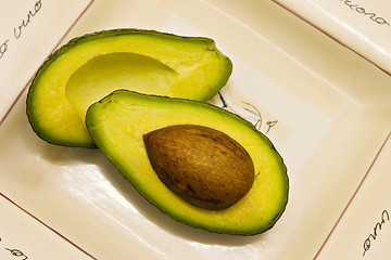 Image showing Avocado halves on plate