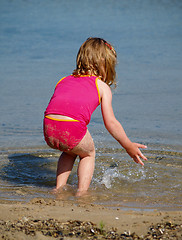 Image showing girl splashing at beach