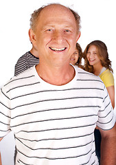 Image showing Handsome old man in focus with family in the background