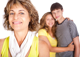 Image showing Old lady in focus while mother hugs her son in the background