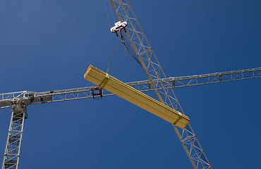 Image showing Crane lifting timber