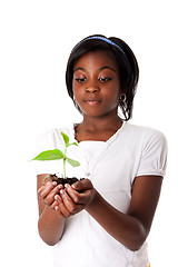 Image showing Girl with plant in hand