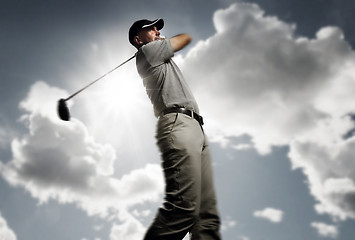 Image showing golfer shooting a golf ball