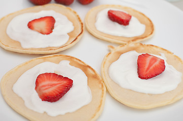 Image showing Flapjacks With Strawberries and Cream