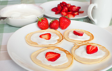 Image showing Flapjacks With Strawberries and Cream
