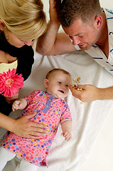 Image showing Mother father and baby playing