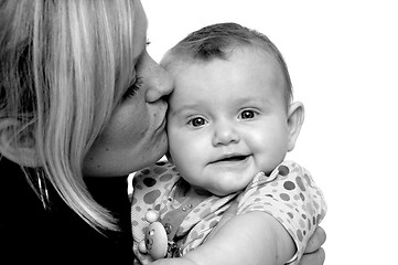 Image showing Mother is kissing baby