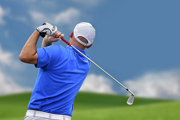 Image showing golfer shooting a golf ball