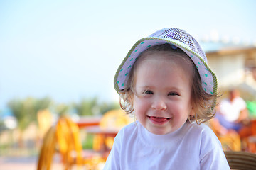 Image showing laughing little girl in hat