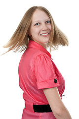 Image showing girl in red dress turned back with a smile