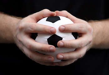 Image showing Holding a soccer ball