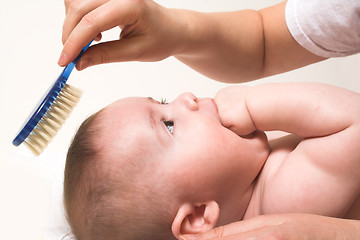 Image showing comb and baby