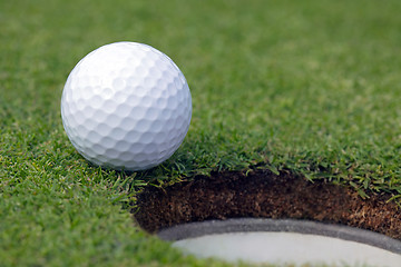 Image showing Golfball almost in the hole 