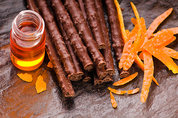 Image showing chocolate sticks with orange