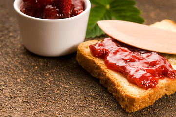 Image showing Wild strawberry jam with toast