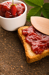 Image showing Wild strawberry jam with toast
