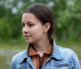 Image showing A girl in a denim jacket