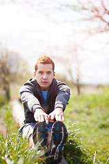 Image showing Mixed race man stretching