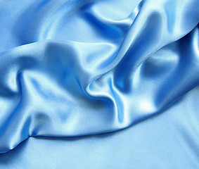 Image showing Smooth elegant blue silk as background 