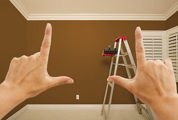 Image showing Hands Framing Brown Painted Wall Interior
