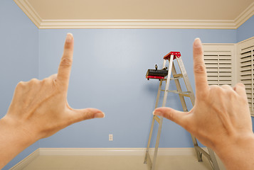 Image showing Hands Framing Blue Painted Wall Interior