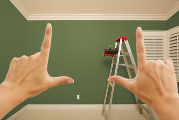 Image showing Hands Framing Green Painted Wall Interior