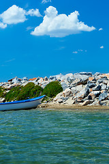 Image showing beach with stones and boats