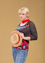 Image showing blond woman and straw bonnet