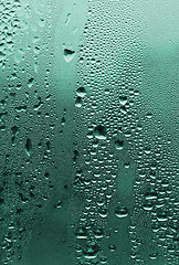 Image showing natural water drops on glass