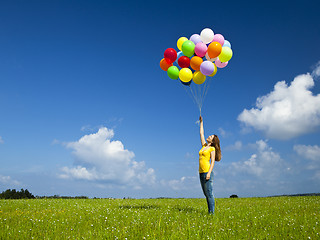 Image showing Girl with colorful balloons