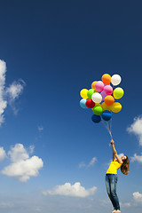 Image showing Girl with colorful balloons