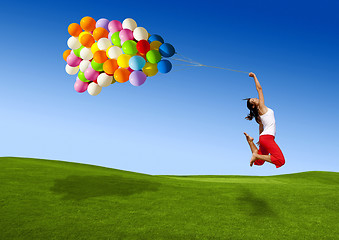 Image showing Jumping with balloons