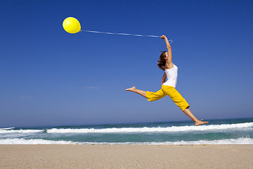 Image showing Jumping with balloons