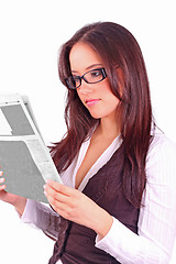 Image showing beautiful brunette reading the morning paper