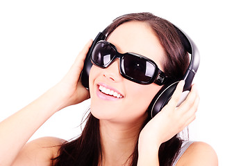 Image showing  woman with headphones listening to music 