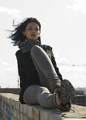 Image showing Young woman on roof