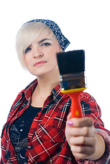 Image showing Young woman with paintbrush