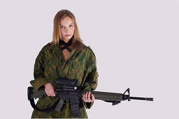 Image showing Woman with gun on white