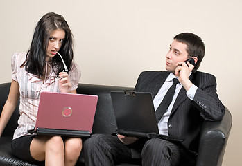 Image showing Businessmen with computers on sofa