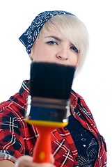 Image showing Young woman with paintbrush