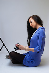 Image showing Young woman with camera