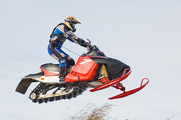Image showing Flying sportsman on snowmobile