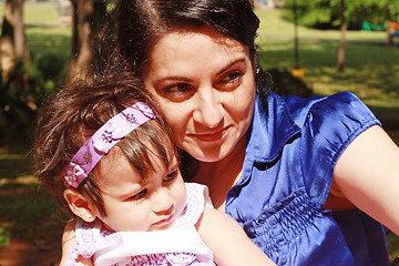 Image showing Mom and Daughter watching the attractions of the park