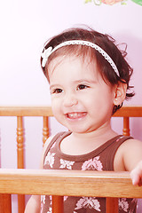 Image showing Adorable baby girl in nursery