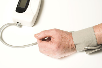 Image showing senior taking blood pressure